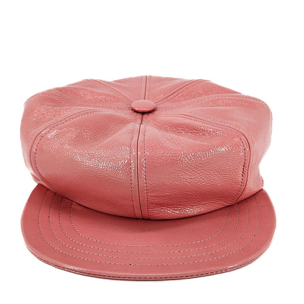 Pink leather cap on a white background