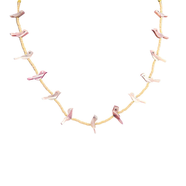 Necklace with pink flamingo pendants on a white background
