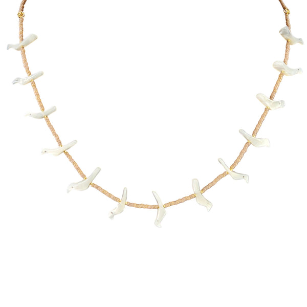 Necklace with white shell-like pendants on a beige cord against a white background