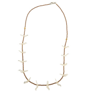 Necklace with white shell-like pendants on a brown cord against a white background