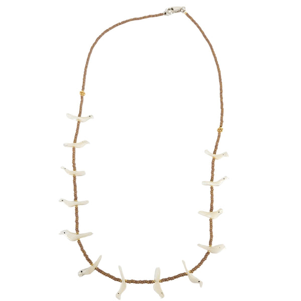 Necklace with white shell-like pendants on a brown cord against a white background