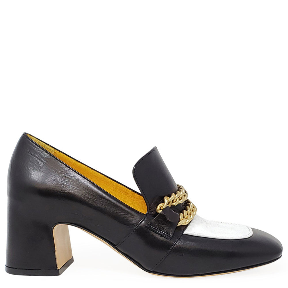 Black and white shoe with gold chain detail on a white background