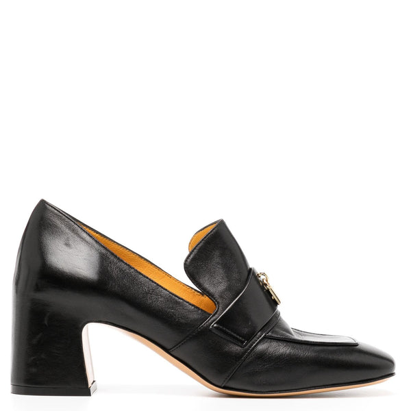 Black leather shoe with a gold buckle on a white background