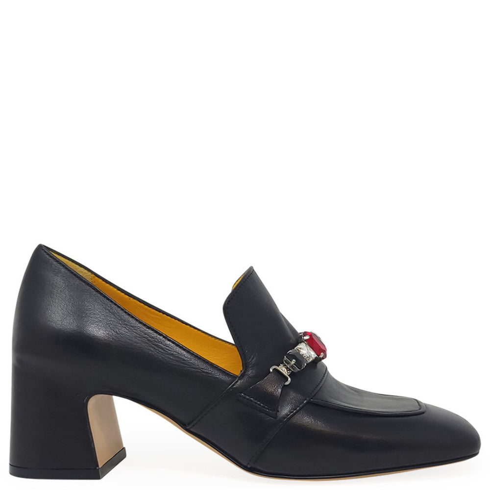 Black leather shoe with a decorative buckle on a white background