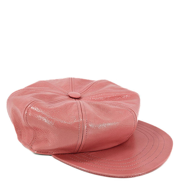 Pink leather cap on a white background