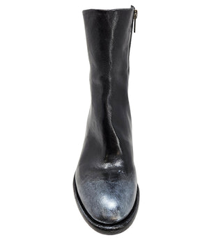 Mid-heel ankle boot crafted from premium leather with a softly rounded toe, artisanal distressed detailing at the toe and heel, and a stacked block heel. Features a full side zipper for easy entry, a leather-lined interior for comfort, and a durable leath
