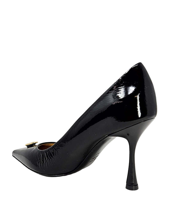 Pointed-toe stiletto pump with a sleek, glossy finish, mid-height heel, and gold lock embellishment at the toe. Features a sculpted silhouette and cushioned interior.