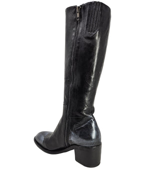 Tall leather boot featuring a softly rounded toe, mid-height stacked block heel, full side zipper for easy on and off, and a decorative metal lock accent near the top shaft. Crafted from premium leather with artisanal distressed detailing at the toe and h