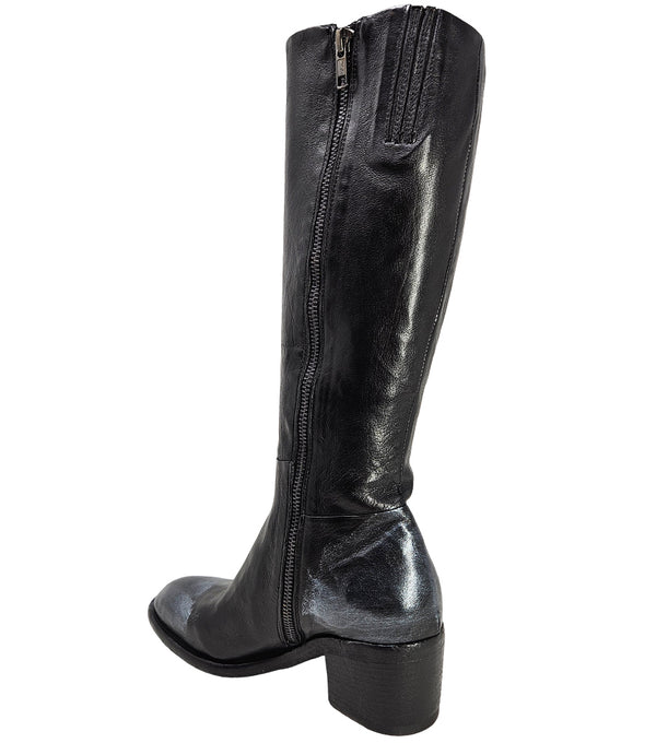 Tall leather boot featuring a softly rounded toe, mid-height stacked block heel, full side zipper for easy on and off, and a decorative metal lock accent near the top shaft. Crafted from premium leather with artisanal distressed detailing at the toe and h