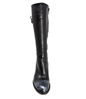 Tall leather boot featuring a softly rounded toe, mid-height stacked block heel, full side zipper for easy on and off, and a decorative metal lock accent near the top shaft. Crafted from premium leather with artisanal distressed detailing at the toe and h
