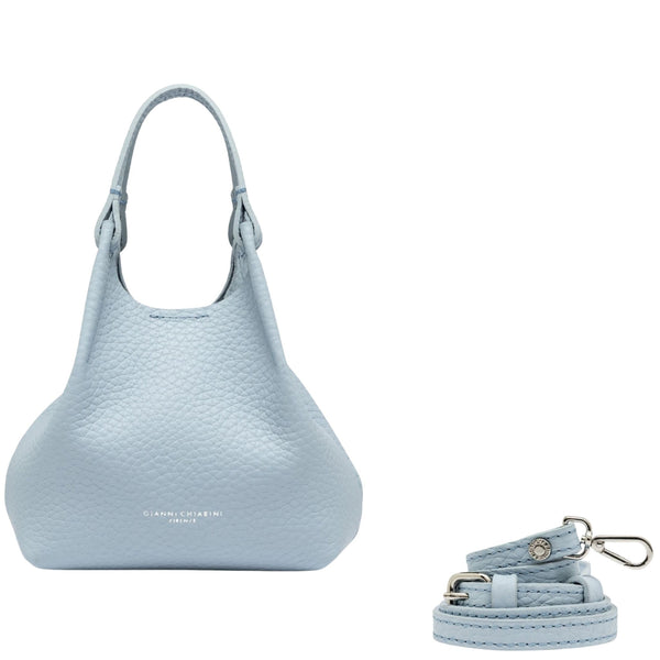 Light blue handbag with matching keychain on a white background