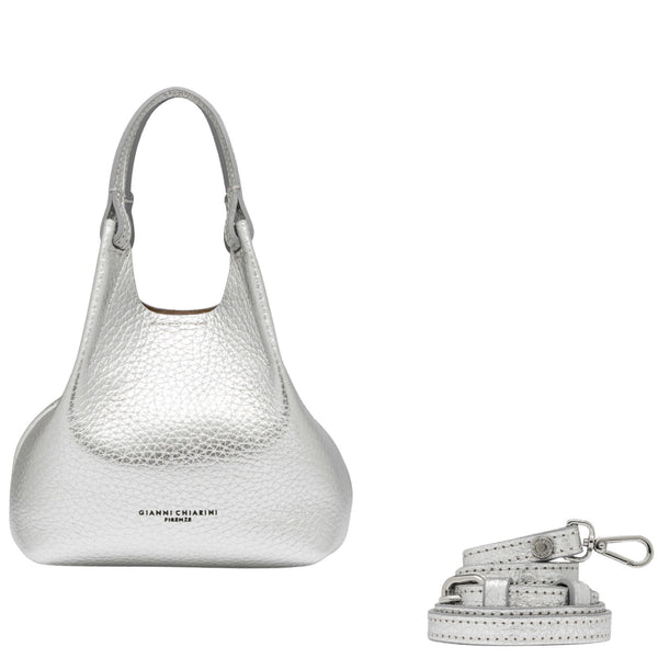 Silver handbag with matching strap on a white background