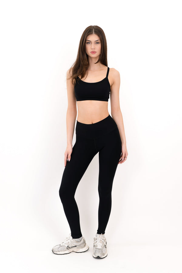 Model wearing The Form Bra in Onyx by ON/OFF Essentials, made from 95% bamboo.