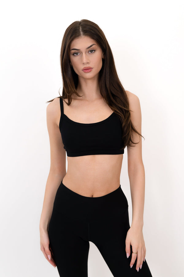 Model wearing The Form Bra in Onyx by ON/OFF Essentials, made from 95% bamboo.