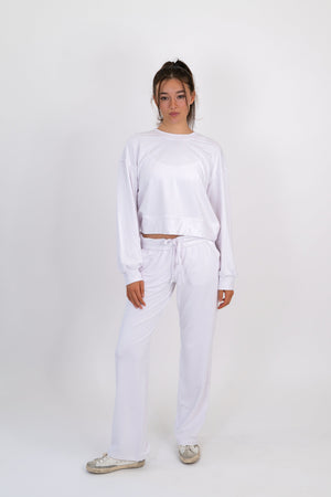 Model wearing The Solace Wide Leg Sweatpant in Cloud by ON/OFF Essentials, made from 95% bamboo fleece.