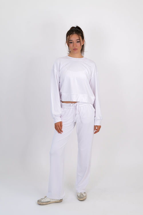 Model wearing The Solace Wide Leg Sweatpant in Cloud by ON/OFF Essentials, made from 95% bamboo fleece.
