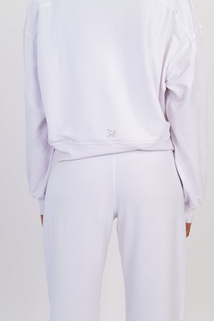 Model wearing The Solace Crew Neck in Cloud by ON/OFF Essentials, made from 95% bamboo fleece.