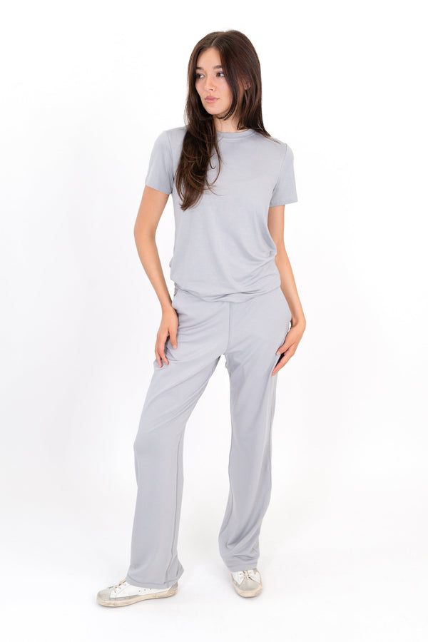 Model wearing The Solace Wide Leg Sweatpant in Fog by ON/OFF Essentials, made from 95% bamboo fleece.