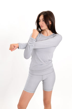 Model wearing The Core Short 5” in Fog by ON/OFF Essentials, made from 95% bamboo.