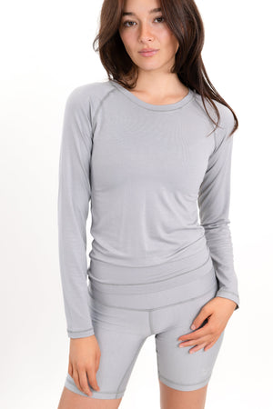 Model wearing The Everyday Long Sleeve in Fog by ON/OFF Essentials, made from 95% bamboo.