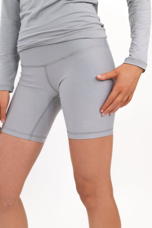 Model wearing The Core Short 5” in Fog by ON/OFF Essentials, made from 95% bamboo.