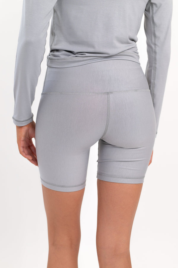 Model wearing The Core Short 5” in Fog by ON/OFF Essentials, made from 95% bamboo.