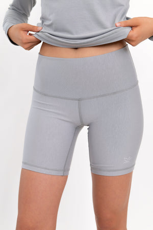 Model wearing The Core Short 5” in Fog by ON/OFF Essentials, made from 95% bamboo.