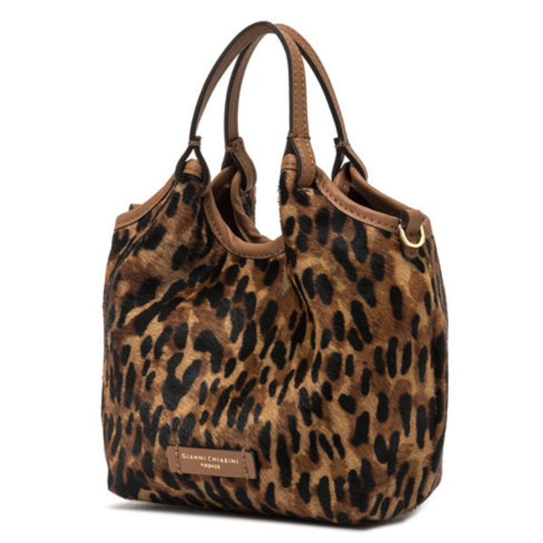 Leopard print handbag with brown handles on a white background