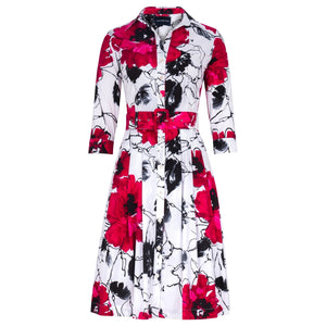 Floral patterned dress with red, black, and white colors on a white background