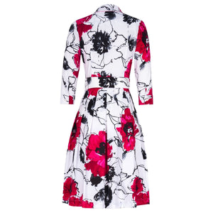 Floral dress with red, black, and white pattern on a white background