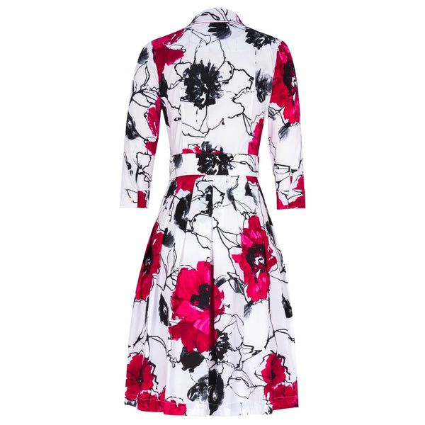 Floral dress with red, black, and white pattern on a white background
