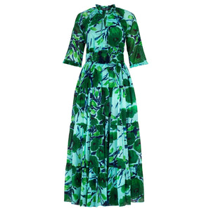 Green and blue floral patterned dress on a white background