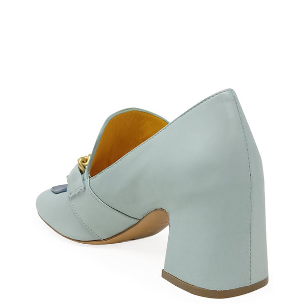 Light blue shoe with a gold buckle on a white background