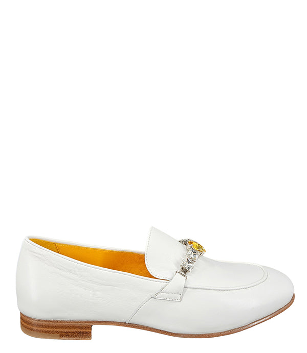A leather loafer with a low stacked heel and rounded toe, featuring a decorative band adorned with faceted gemstone-style embellishments across the upper. Designed by Madison in Beverly Hills and handcrafted in Italy