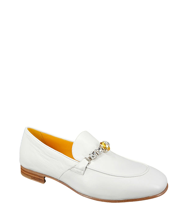 A leather loafer with a low stacked heel and rounded toe, featuring a decorative band adorned with faceted gemstone-style embellishments across the upper. Designed by Madison in Beverly Hills and handcrafted in Italy
