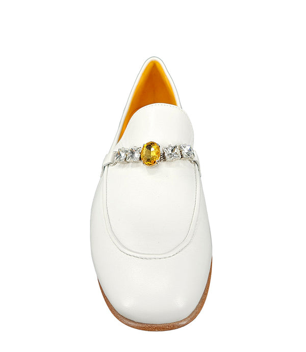 A leather loafer with a low stacked heel and rounded toe, featuring a decorative band adorned with faceted gemstone-style embellishments across the upper. Designed by Madison in Beverly Hills and handcrafted in Italy