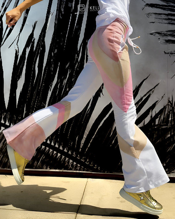 Women's full-length lounge pants made in Italy from a soft, stretch-blend fabric, featuring a wide waistband with drawstring tie and abstract panel detailing along the legs for a modern, relaxed silhouette.