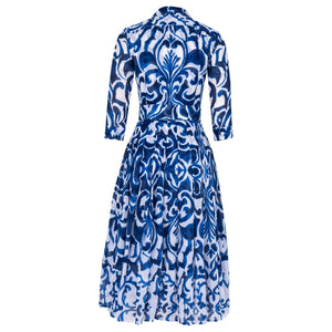 Blue and white patterned dress on a white background