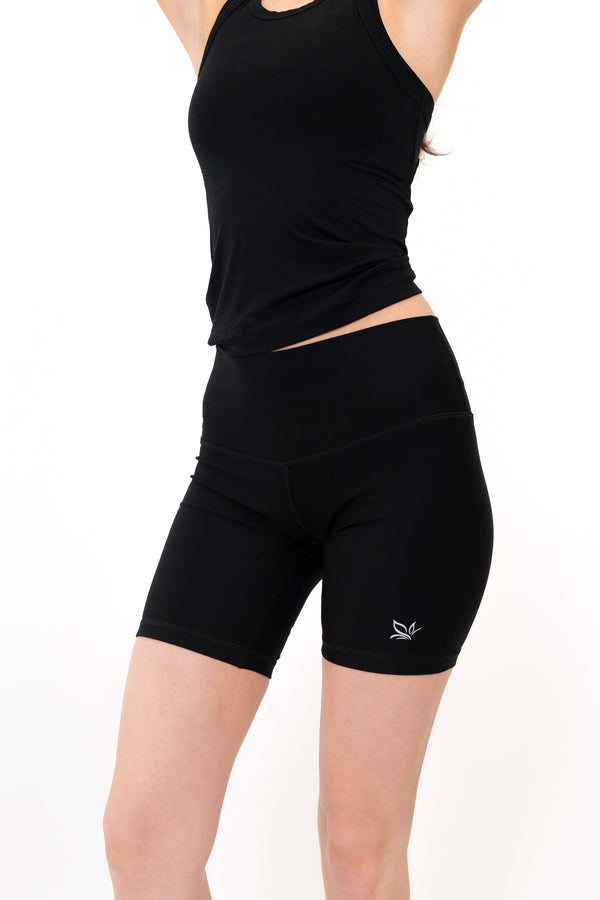Model wearing The Core Short 5” in Onyx by ON/OFF Essentials, made from 95% bamboo.