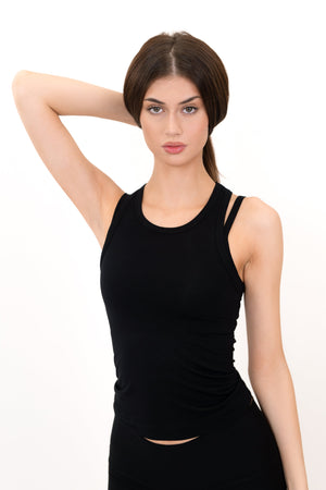 Model wearing The Essential Tank in Onyx by ON/OFF Essentials, made from 95% bamboo.
