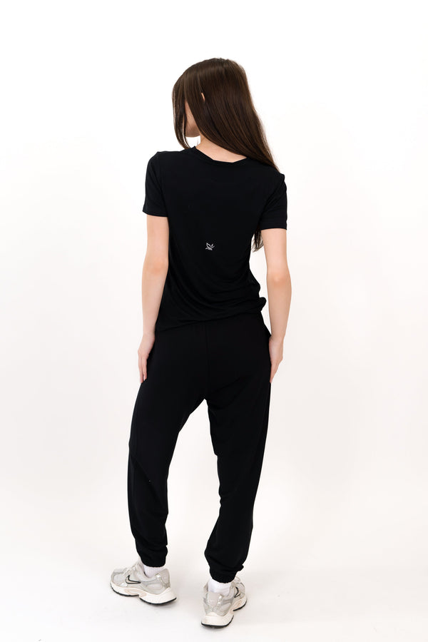 Model wearing The Everyday Tee in Onyx by ON/OFF Essentials, made from 95% bamboo.