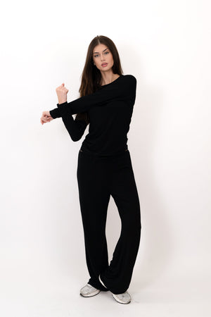 Model wearing The Everyday Long Sleeve in Onyx by ON/OFF Essentials, made from 95% bamboo.