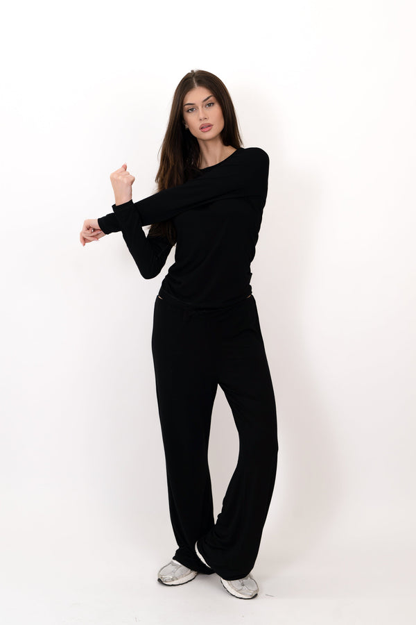 Model wearing The Everyday Long Sleeve in Onyx by ON/OFF Essentials, made from 95% bamboo.