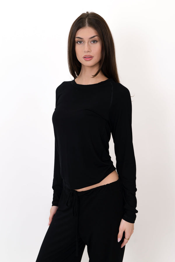 Model wearing The Everyday Long Sleeve in Onyx by ON/OFF Essentials, made from 95% bamboo.