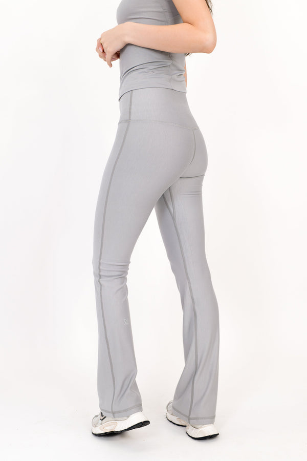 Model wearing The Core Flare Legging in Fog by ON/OFF Essentials, made from 95% bamboo.