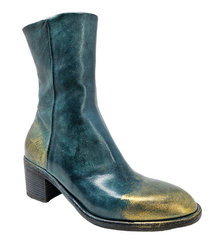 Mid-heel ankle boot crafted from premium leather with a softly rounded toe, artisanal distressed detailing at the toe and heel, and a stacked block heel. Features a full side zipper for easy entry, a leather-lined interior for comfort, and a durable leath