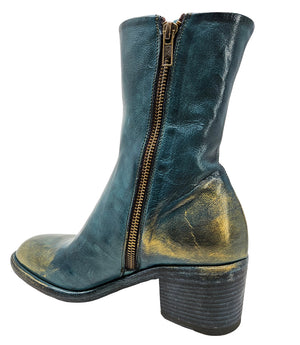 Mid-heel ankle boot crafted from premium leather with a softly rounded toe, artisanal distressed detailing at the toe and heel, and a stacked block heel. Features a full side zipper for easy entry, a leather-lined interior for comfort, and a durable leath