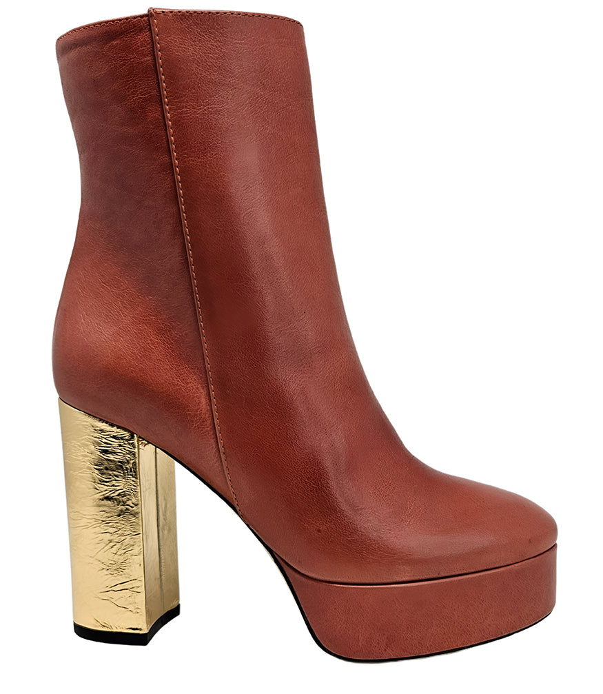 "High-heel ankle boot crafted from smooth premium leather with a sleek rounded toe, an inner side zipper for easy wear, a supportive leather-wrapped platform, and a sturdy metallic block heel. Designed with a soft leather lining and a durable leather sole