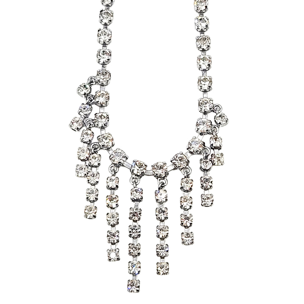 Rhinestone centerpiece necklace with curved neckline and multi-row fringe drop