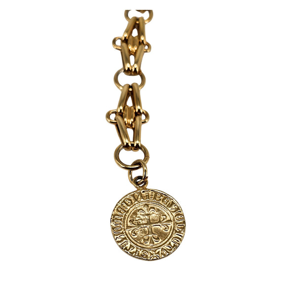 Gold round coin medallion charm pendant on chain belt, detailed face